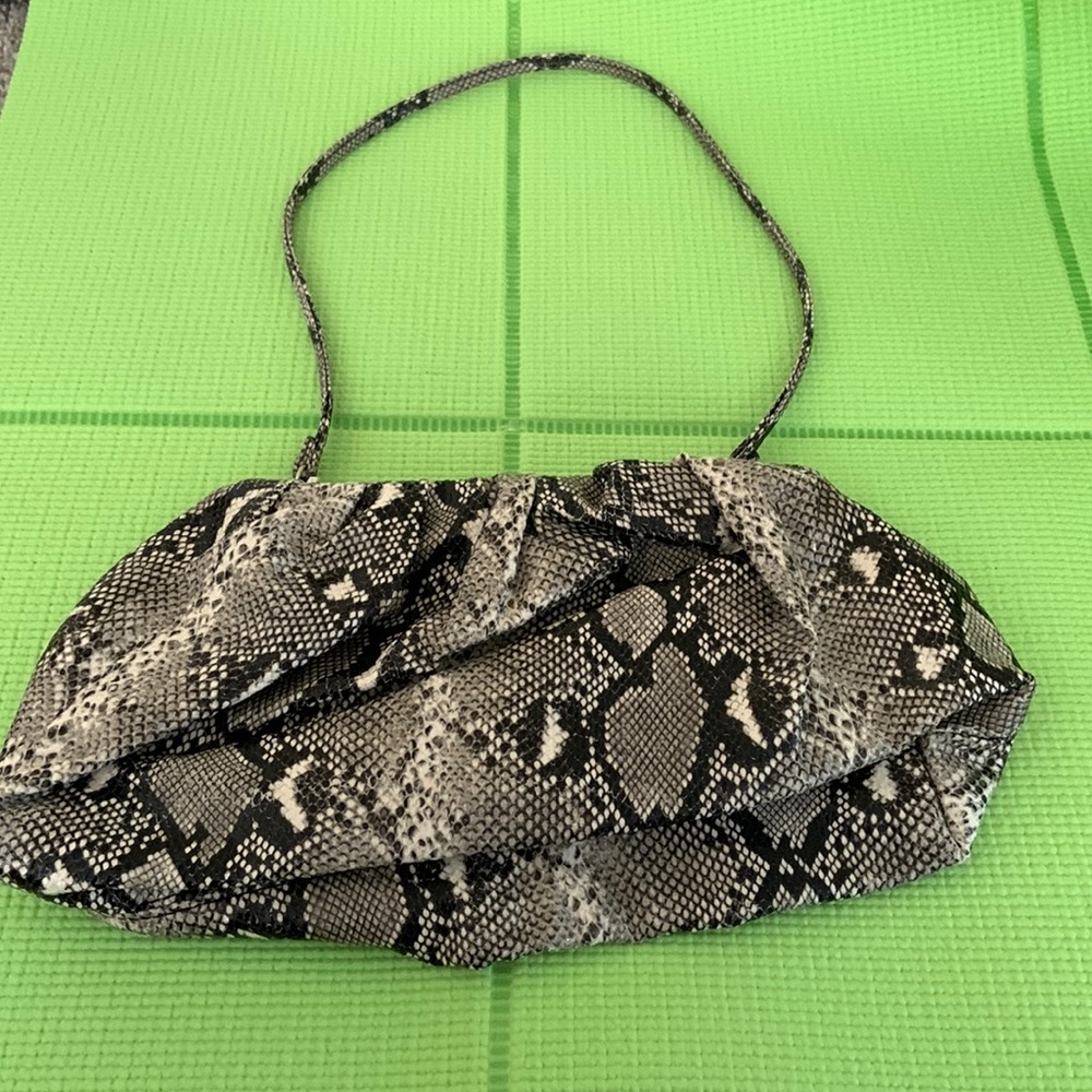 Express mini shoulder bag in snake print.